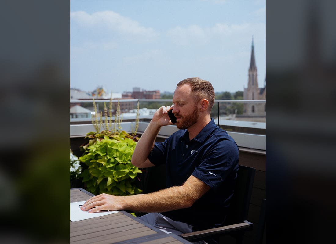 Moving to Indiana - Jackson Blevins Answering Phone Call Outdoors in Indiana