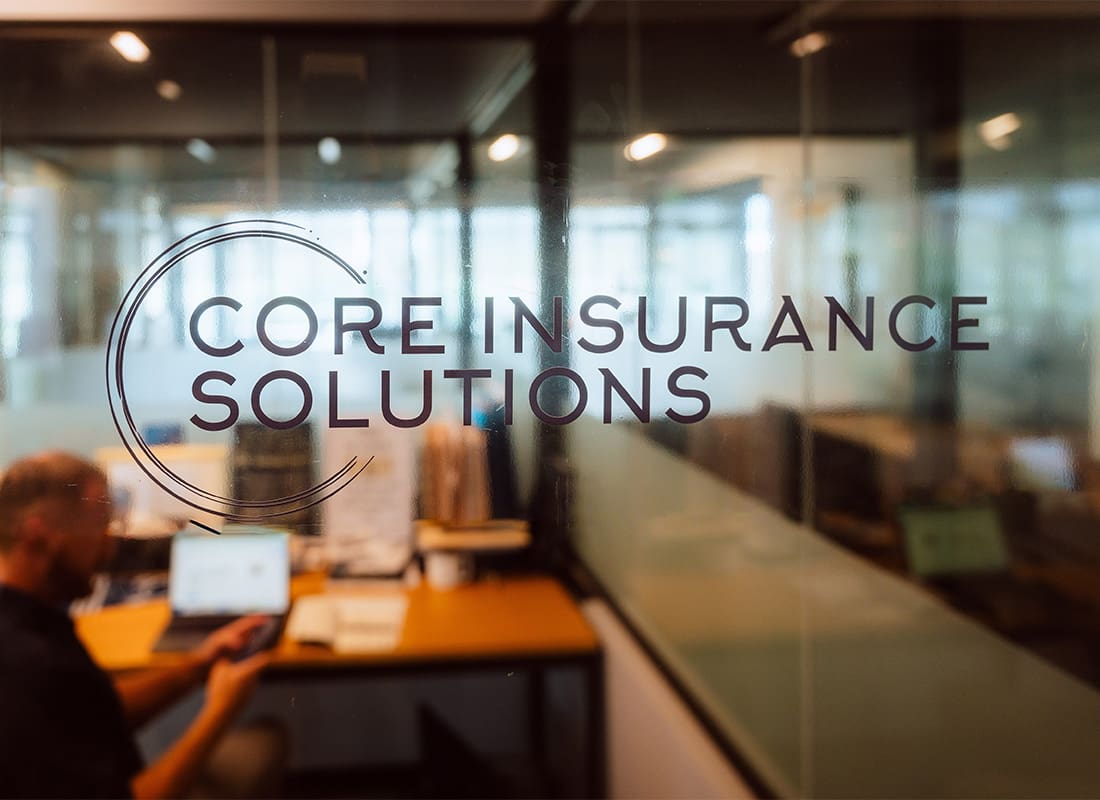 High Net Worth - Core Insurance Solutions Logo in Office Window